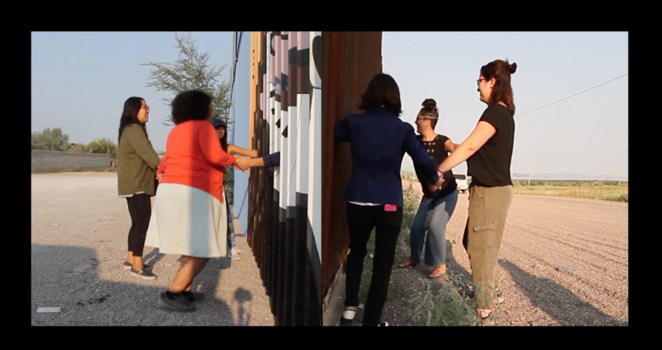 Group of women near a wall holding hands